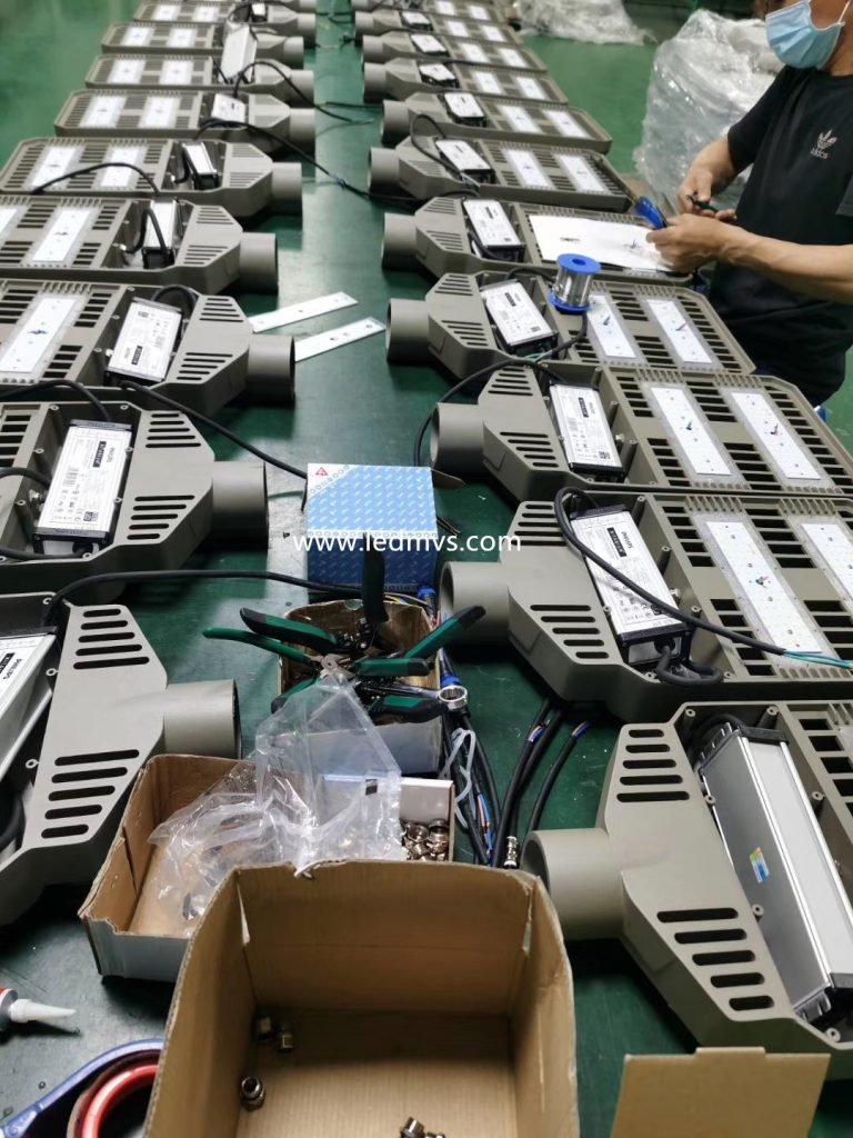 Technicians at MVS factory conduct meticulous assembly and quality inspection on high-performance LED street lights. Each unit is equipped with advanced drivers and robust heat dissipation systems, ensuring long-term durability and consistent performance. This production stage is part of MVS's strict 5-year reliability assurance process.