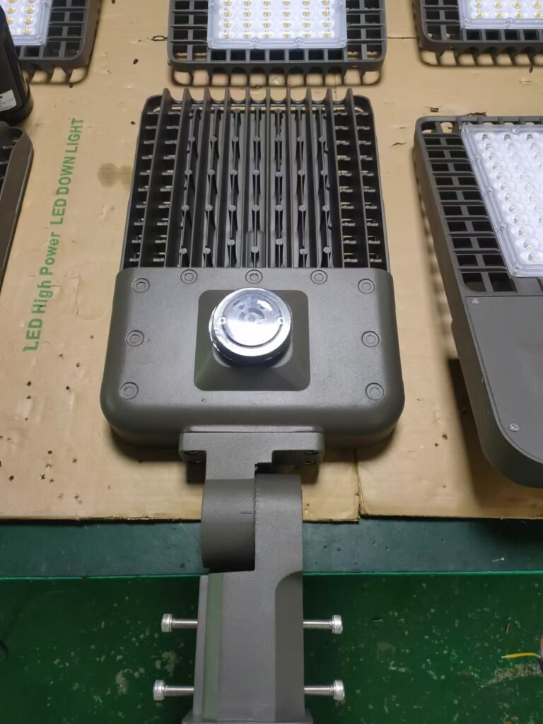 Motion sensor streetlight with durable heat dissipation fins and LED module design for enhanced outdoor lighting efficiency