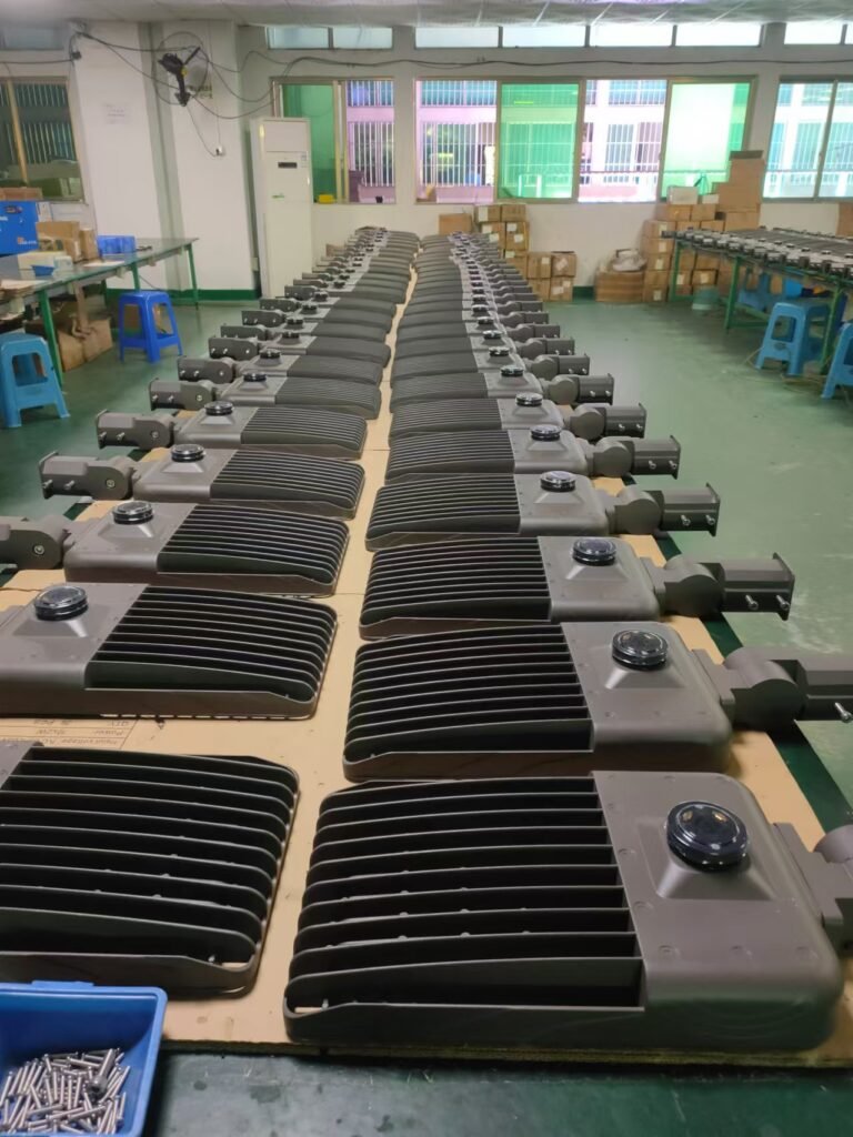 Factory production line of motion sensor streetlights featuring advanced heat dissipation fins and precision engineering for energy-efficient outdoor lighting.