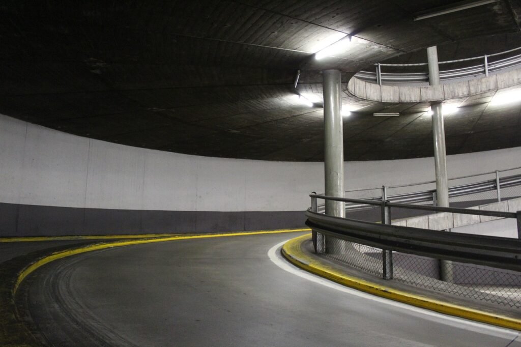 Underground parking lot ramp illuminated with efficient LED lighting for enhanced visibility and driver safety