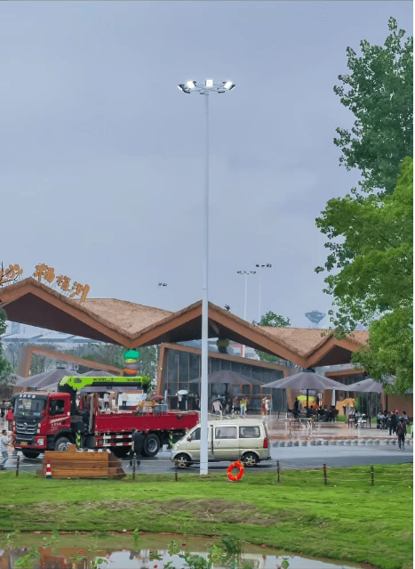 high-mast LED floodlight installation at riverside scenic plaza