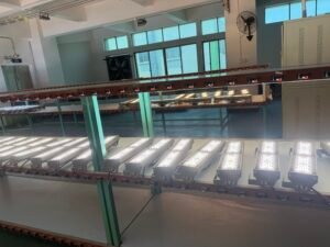 Commercial LED floodlights undergoing aging and quality testing on the MVS factory production line