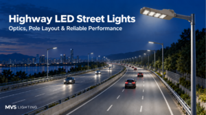 LED street lights illuminating a divided multilane highway at blue hour.